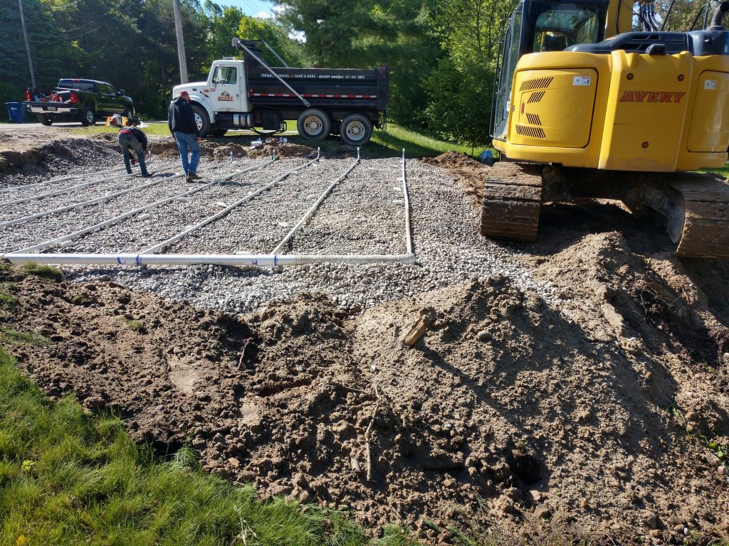 septic replacement drain field system organized on gravel
