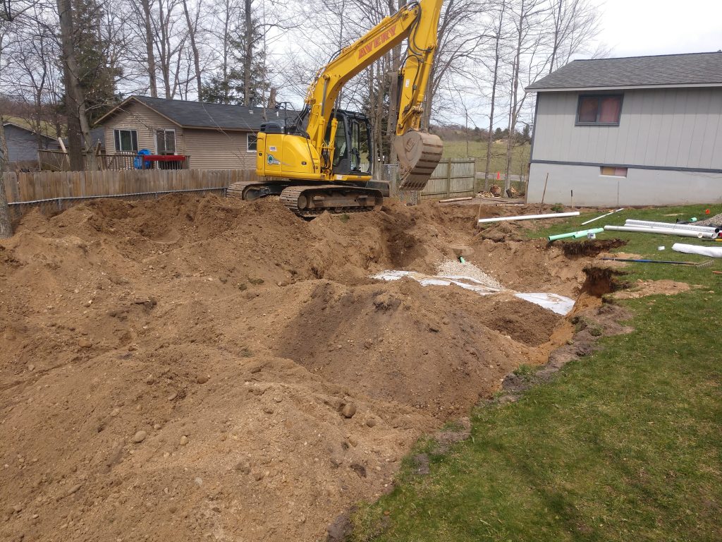 septic tank replacement excavation in backyard