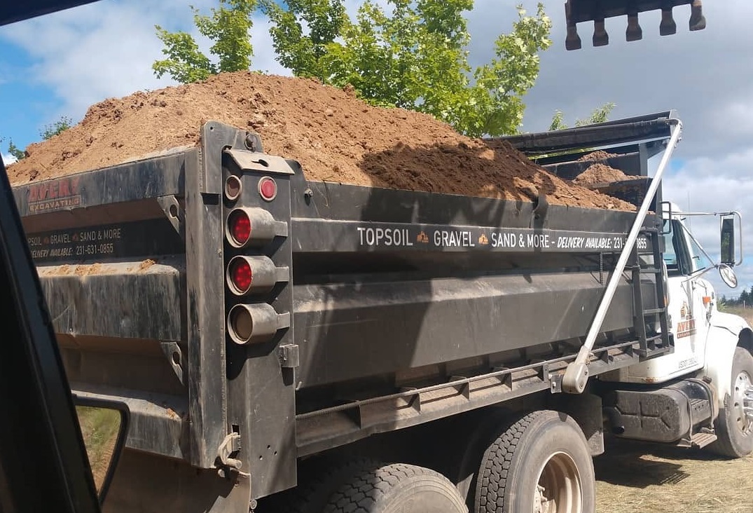 Topsoil delivery truck by Avery Excavating